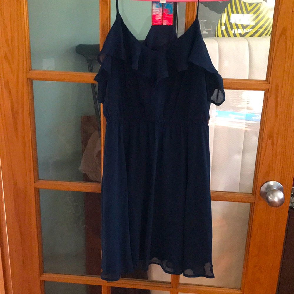 Ruffle midi lightweight dress. Spaghetti strap in front to decretive T in back.